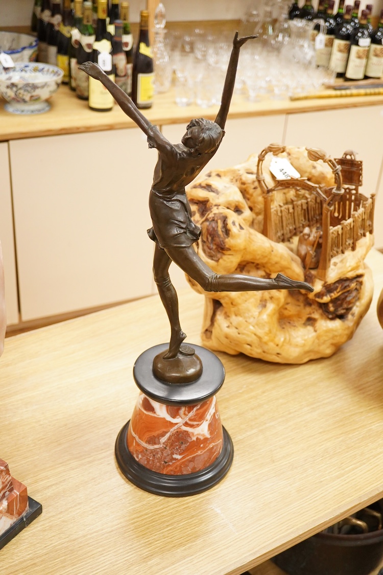 After Bruno Zach (1891-1945), an Deco style bronze of a dancing lady, raised on a marble and slate base, 65cm high